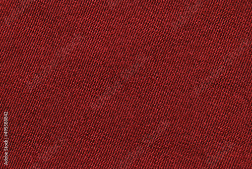 Red twill cotton fabric pattern close up as background photo