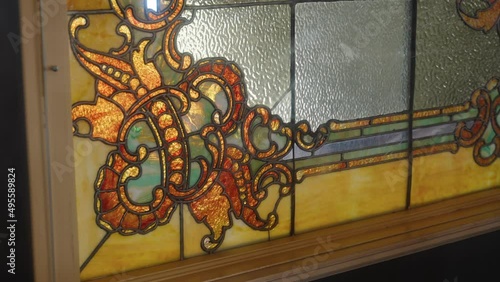 close up of bottom corner of a stained glass window in a 1900s mansion photo