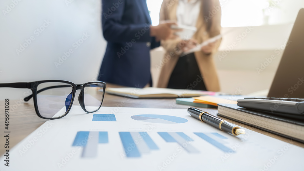 Business team brainstorming and discussing with financial data and report graph. Teamwork meeting working concept. Business team brainstorming and discussing with financial data and report graph. Teamwork meeting working concept.