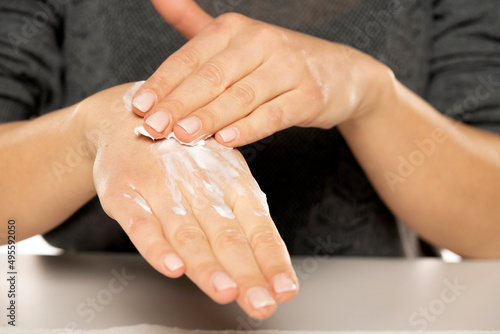 Beautiful Woman Hands. Female Hands Applying Cream, Lotion. Female hands with soft skin, skincare concept. Hand Skin Care