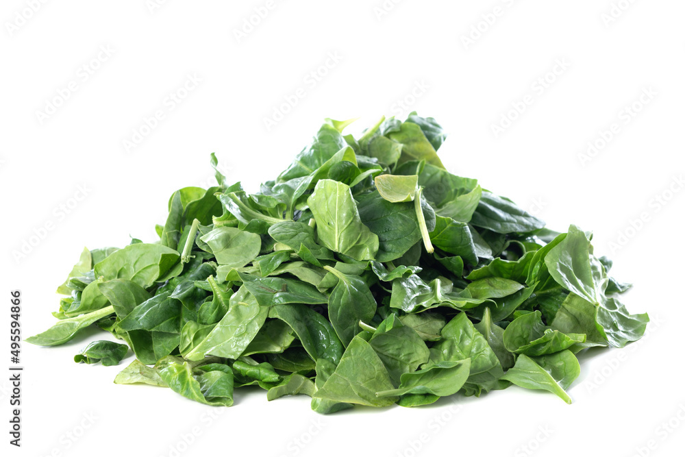 Pile of fresh green baby spinach leaves isolated on white background Pile of fresh green baby spinach leaves isolated on white background
