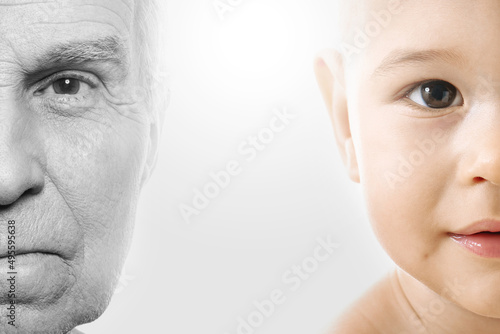 Elderly man and baby boy. Concept of rebirth and cycle of life. photo