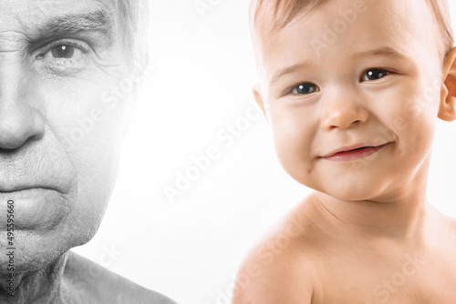 Elderly man and baby boy. Concept of rebirth and cycle of life. photo