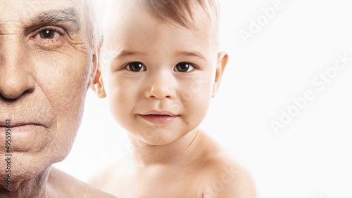 Elderly man and baby boy. Concept of rebirth and cycle of life.