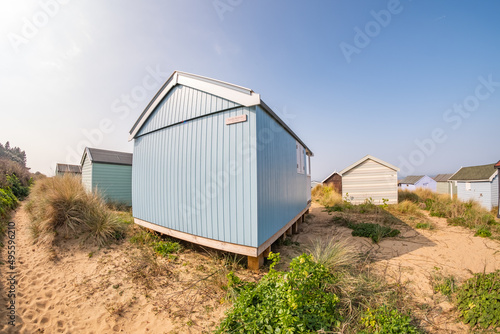 Ultra wide angle fisheye shot of traditional wooden beach huts on Hunstanton beach on the North Norfolk coast © yackers1