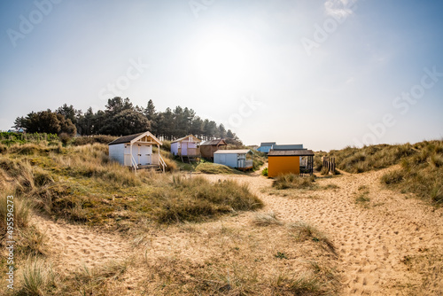 Ultra wide angle fisheye shot of traditional wooden beach huts on Hunstanton beach on the North Norfolk coast