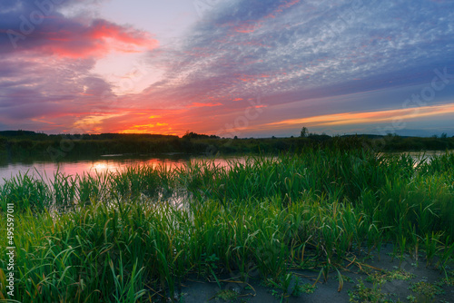 A beautiful landscape with sky at sunset on the river in summertime