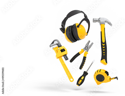 Flying view of yellow construction tools for repair on white