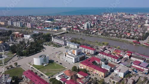 View from drone of modern landscape of Georgian port city of Poti overlooking residential areas and Orthodox Cathedral in Neo-Byzantine style on sunny spring day, Samegrelo-Zemo Svaneti region photo