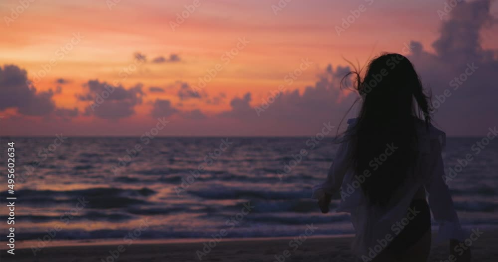 Silhouette of pregnant woman lovingly stroking her belly at the beach in the morning. concept for pregnant women. Silhouette of pregnant woman lovingly stroking her belly at the beach in the morning. concept for pregnant women.