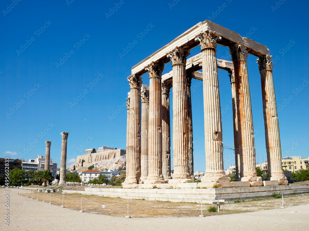 The Olympian Zeus, ancient Corinthian style temple, and Acropolis of Athens in the background, Greece