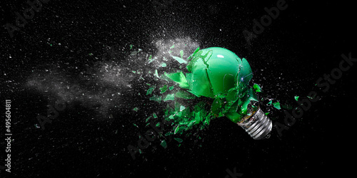 green electric light bulb exploding