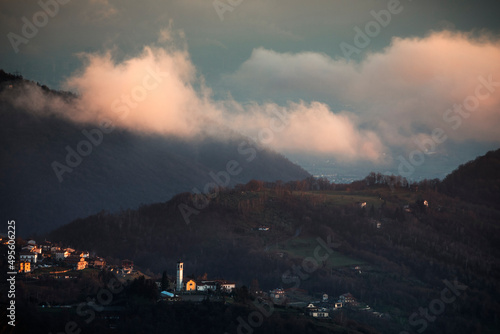 sunset clouds over the town in the mountains