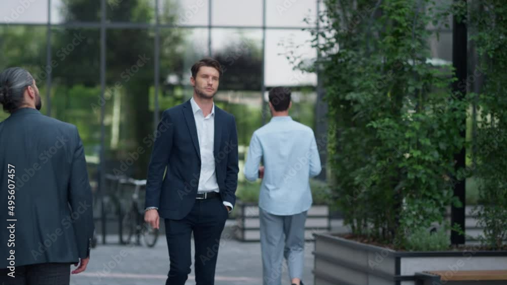 Business people walking office building. Financial company employees concept. Business people walking office building. Financial company employees concept.