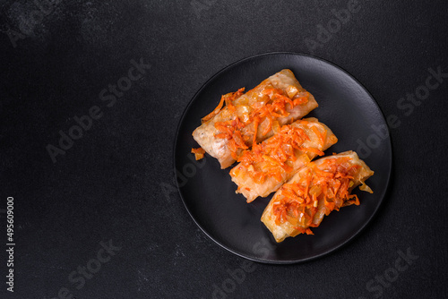 Cabbage rolls stuffed with ground beef and rice in tomato sauce
