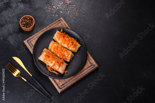 Cabbage rolls stuffed with ground beef and rice in tomato sauce