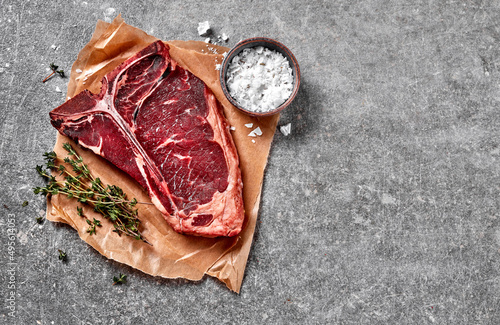 T-bone matured steak with salt and thyme