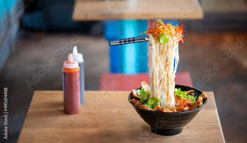 Flying Noodles in einem vietnamesischem Street Food Restaurant in Vietnam  photo