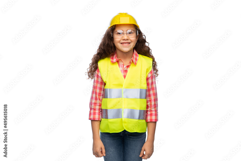 building, construction and profession concept - smiling little girl in goggles, protective helmet and safety vest over white background building, construction and profession concept - smiling little girl in goggles, protective helmet and safety vest over white background