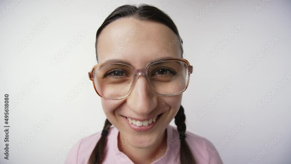 Smiling nerd girl in glasses