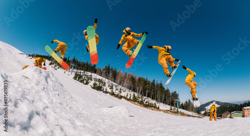 jump storyboard. a guy in an orange suit jumps with a spin on a snowboard and holds a front grab