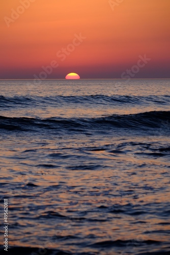 Fototapeta Naklejka Na Ścianę i Meble -  A close-up on a nice sunset at Batz-sur-Mer.
March 2022, France.