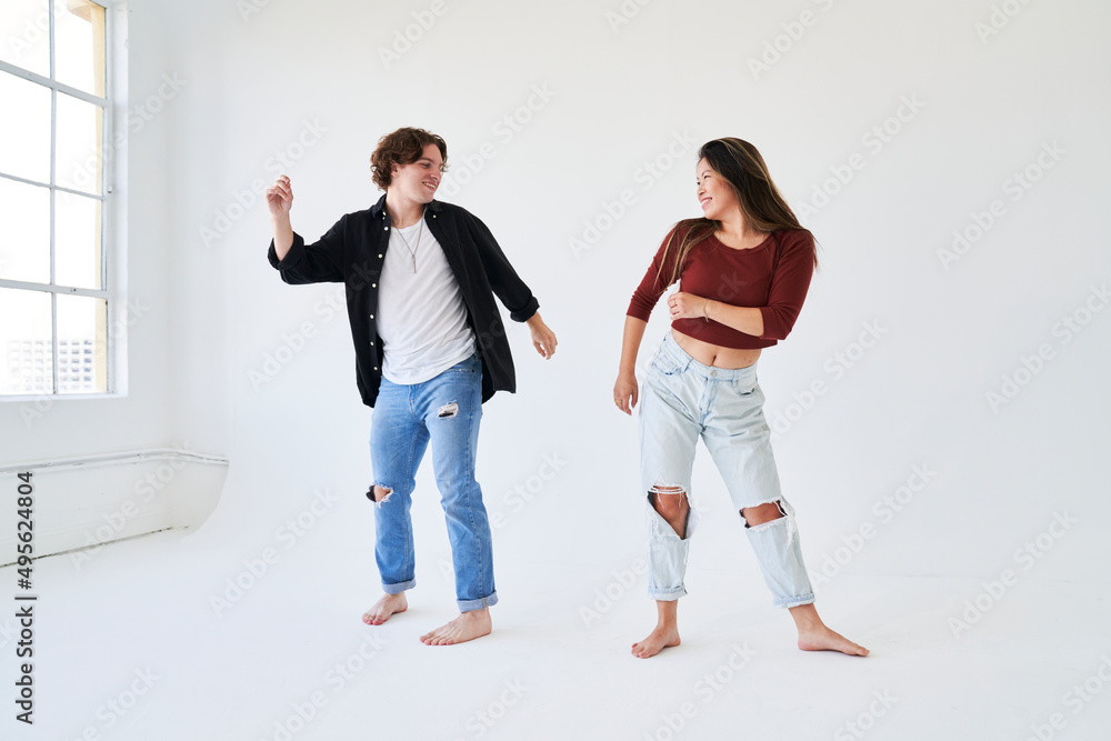 couple dancing separately facing each other