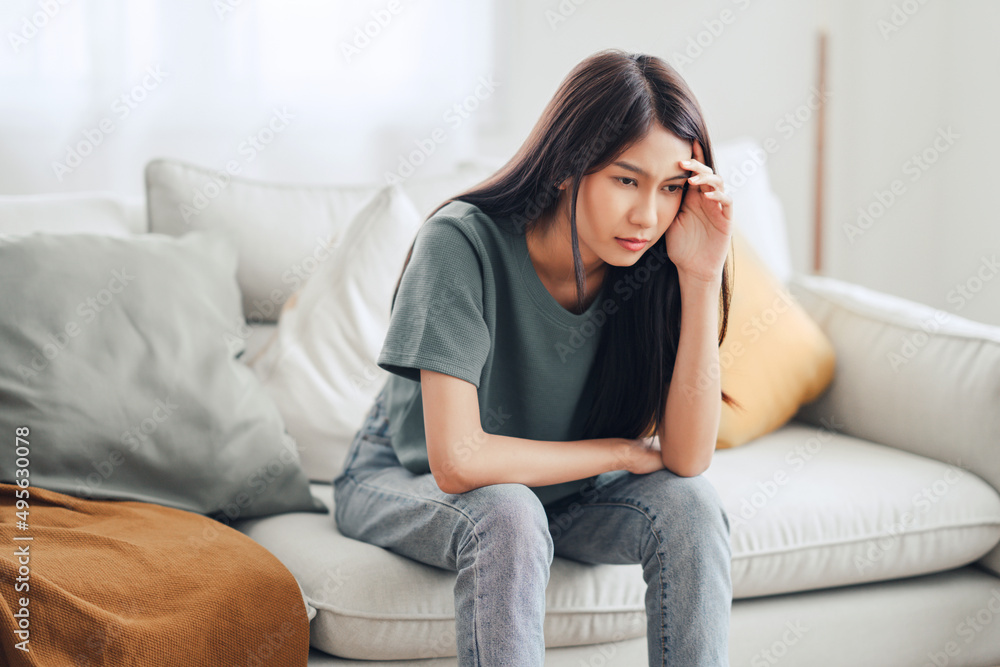 Sad tired young asian woman touching forehead having headache migraine or depression, upset frustrated girl troubled with problem feel stressed, Grief sorrow concept Sad tired young asian woman touching forehead having headache migraine or depression, upset frustrated girl troubled with problem feel stressed, Grief sorrow concept