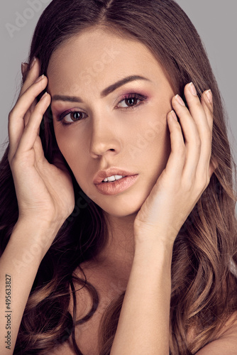 Wallpaper Mural Closeup portrait of beautiful brunette with curly hair touching face Torontodigital.ca
