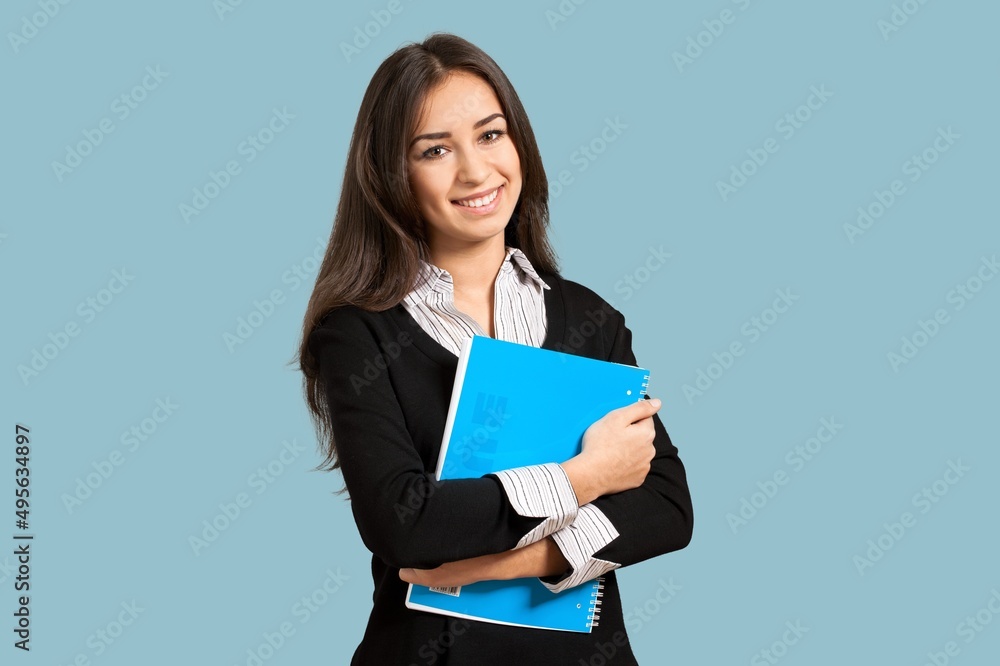Young girl teen student in denim clothes with backpack and holds books. Education concept. Young girl teen student in denim clothes with backpack and holds books. Education concept.