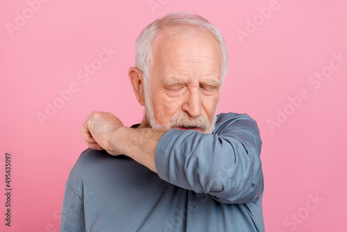 Photo of ill old white hairdo man sneeze wear blue shirt isolated on pink color background © deagreez