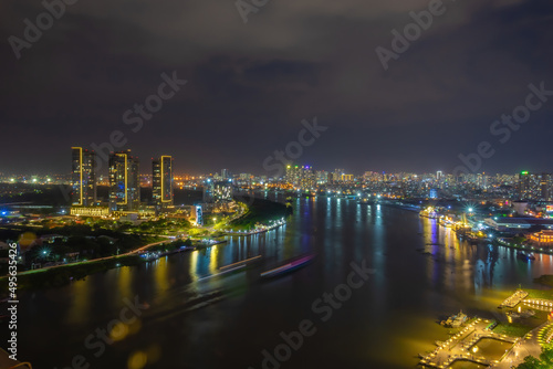 Aerial view of Bitexco Tower  buildings  roads  Thu Thiem 2 bridge and Saigon river in Ho Chi Minh city - Far away is Landmark 81 skyscrapper. This city is a popular tourist destination of Vietnam