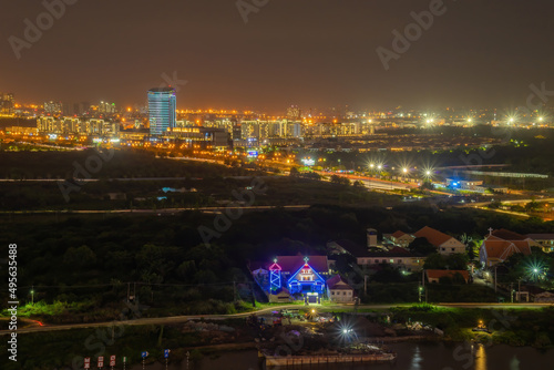 Aerial view of Bitexco Tower  buildings  roads  Thu Thiem 2 bridge and Saigon river in Ho Chi Minh city - Far away is Landmark 81 skyscrapper. This city is a popular tourist destination of Vietnam