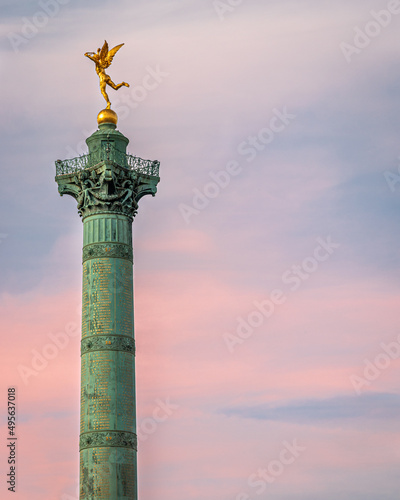 Canvas Print Front view of the Column of Jules in Paris while the pink sunset takes place in the background