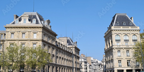 Vertical shot of Caserne Verines against blue sky on a sunny day in Paris, France photo