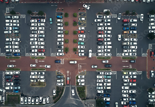 Parking lots are filling up again. High angle shot of a large parking lot in an urban city.