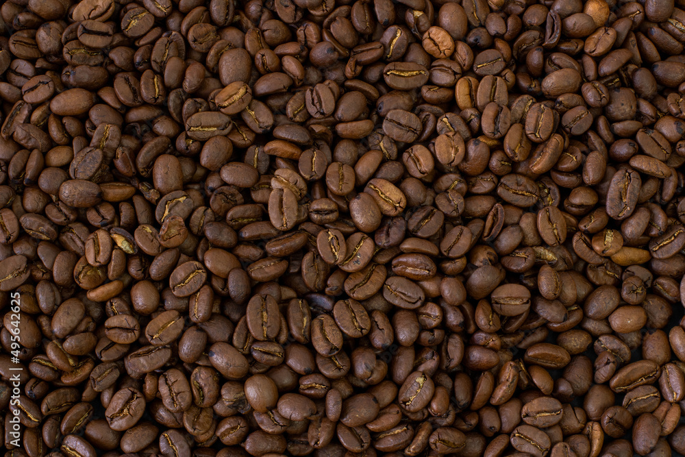 Macro coffee beans background. Close up photographed coffee beans, coffee beans wallpaper Macro coffee beans background. Close up photographed coffee beans, coffee beans wallpaper