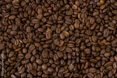 Fototapeta Naklejka Na Ścianę i Meble -  Macro coffee beans background. Close up photographed coffee beans, coffee beans wallpaper