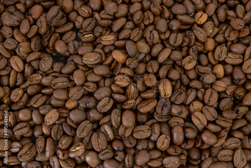 Macro coffee beans background. Close up photographed coffee beans, coffee beans wallpaper