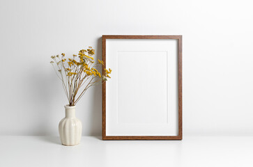 Wooden frame mockup in white minimalistic room with copy space for artwork, photo or print presentation