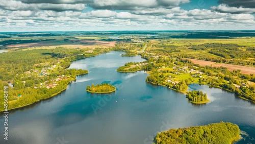 Hyperlapse Timelapse Dronelapse 4K Aerial View Of Villages Houses On Rivers Lakes Islands Summer Day. Top View Of Lake Nature From Attitude. Scenery Scenic Calm Landscape. photo