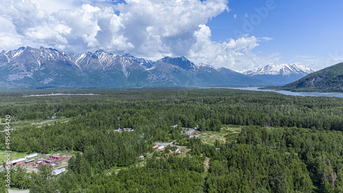 Aerial view of a summer day over the rural area near mountains in Palmer, Alaska