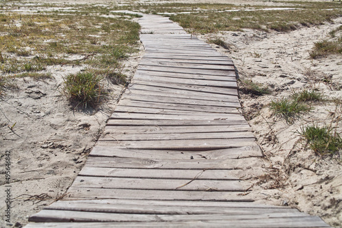 Old wooden walkway on the beach