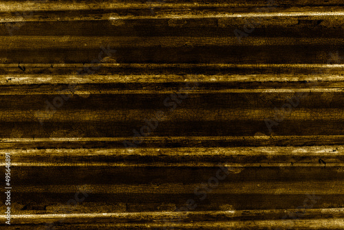 Golden color wavy old industrial metal sheet for texture background