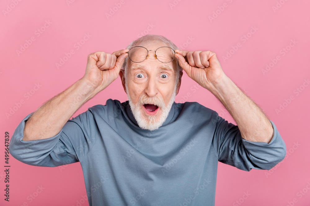 Photo of impressed funky guy pensioner dressed grey pullover arms glasses open mouth isolated pink color background Photo of impressed funky guy pensioner dressed grey pullover arms glasses open mouth isolated pink color background