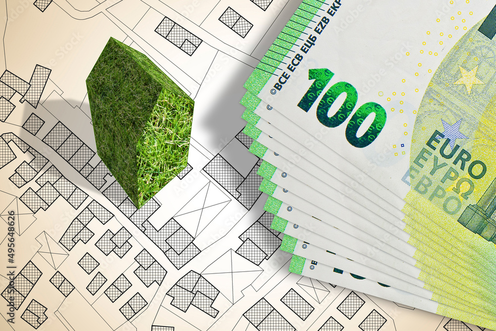 Green building costs concept with an imaginary city map - The ...