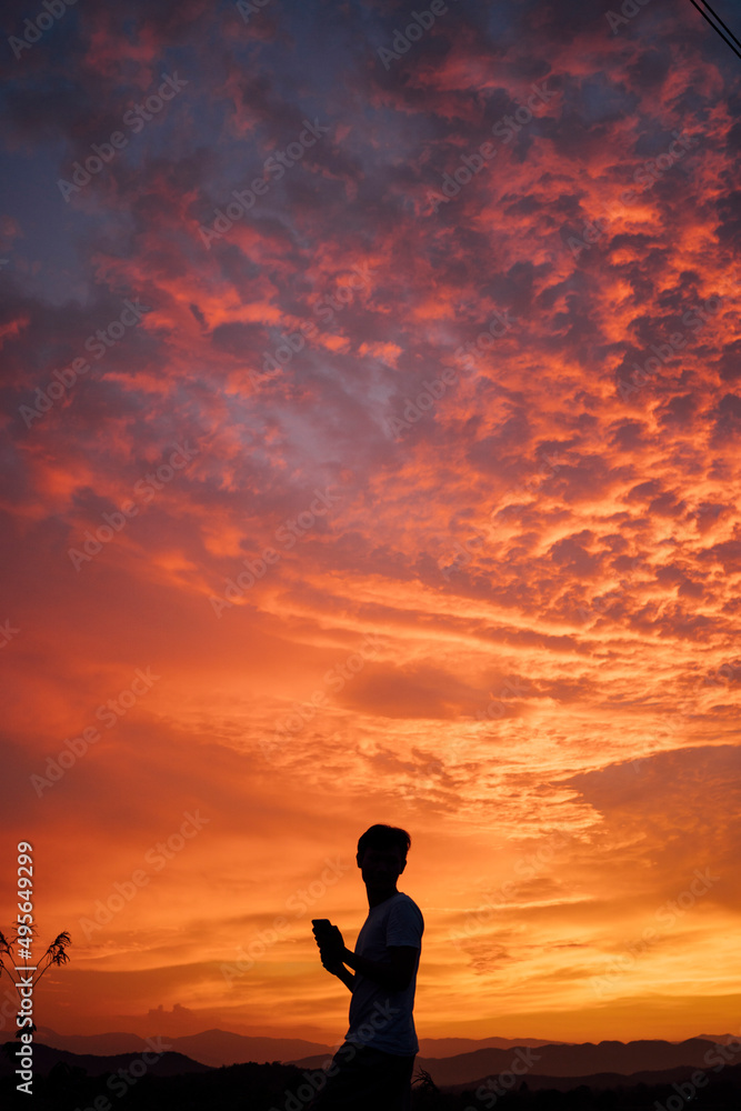 silhouette of a person on the mountain 