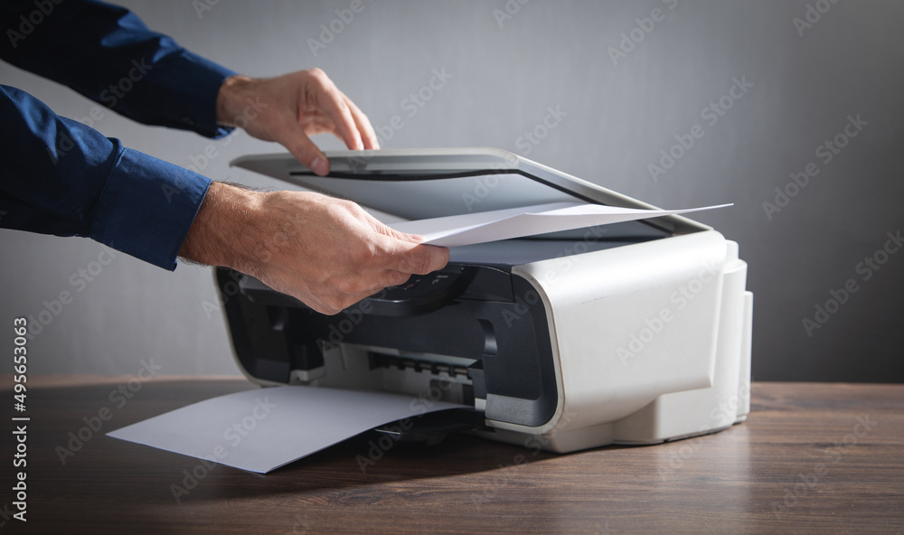 Man copying and scanning documents in office. Man copying and scanning documents in office.