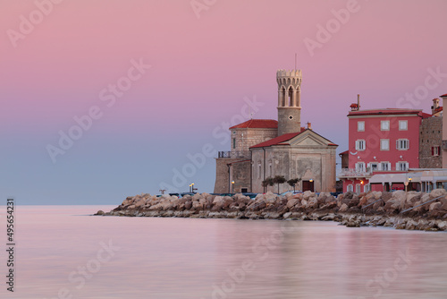 Obraz na płótnie Piran, Slovenia. Cityscape image of Piran, Slovenia with historical church and lighthouse at sunrise. w salonie