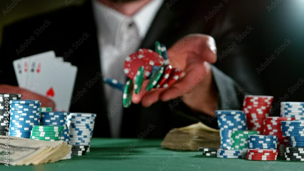 Super slow motion of poker player throwing chip towards camera. Filmed on high speed cinema camera, 1000fps. Super slow motion of poker player throwing chip towards camera. Filmed on high speed cinema camera, 1000fps.